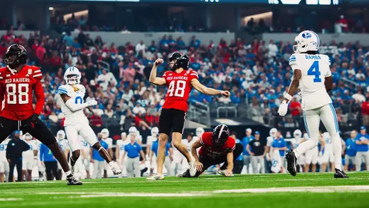 Stone Harrington kicking at Big 12 Championship