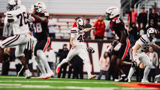 Will Karoll prepares for a punt as the offensive line blocks in front of him during Texas Tech's road win at Oregon State.