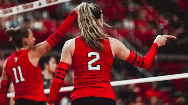 Gretchen Sigman pointing the ball in after scoring a point in a Texas Tech volleyball match