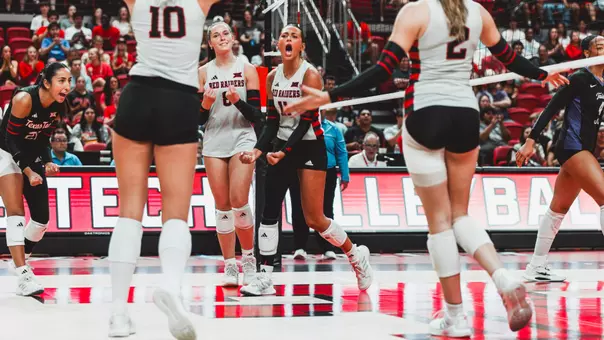 Tatum Johnson celebrating with her teammates after scoring a point