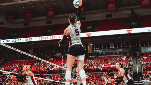 Elia Dinsmore hitting a ball in a volleyball match
