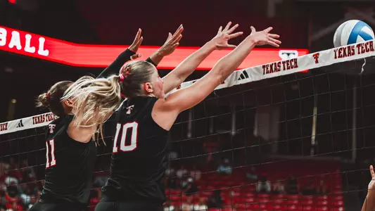 Tatum Johnson and Katelyn Cochran going up for a block for Texas Tech volleyball