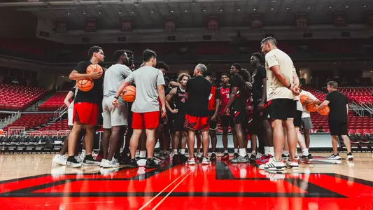 The Texas Tech basketball team huddles before the start of a practice.
