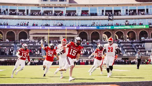 Austin Romaine celebrates after crossing the end zone following his second pick-six interception in Texas Tech's win over Sam Houston.