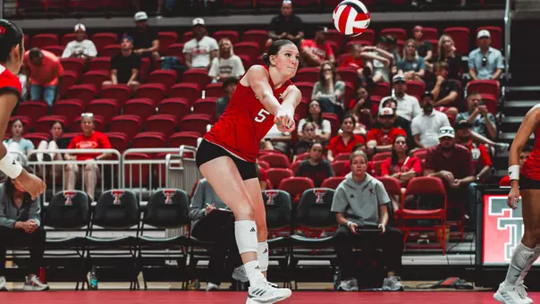 Elia Dinsmore digging out a ball for Texas Tech volleyball against Kansas