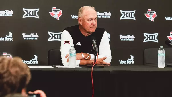 Joey McGuire listens to a reporter's question during his postgame press conference following Texas Tech's win over Sam Houston.