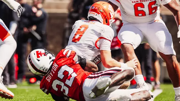 LaDamion Guyton pulls Sam Houston's quarterback to the ground for a sack in Texas Tech's victory over the Bearkats.