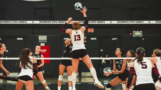 Shelby Ignash jumping to attack a ball against Saint Mary's