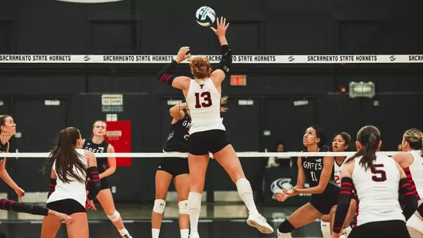 Shelby Ignash jumping to attack a ball against Saint Mary's