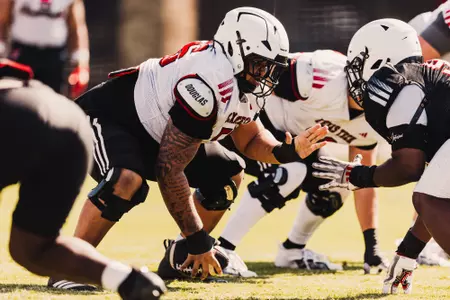 Jerald Mays preparing to snap the ball in practice.