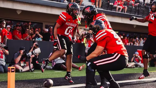Quinten Joyner celebrates with teammates after scoring a touchdown on his first carry in Texas Tech's victory over Abilene Christian.