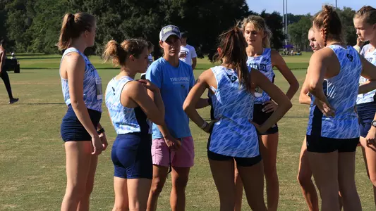 women's CC team huddle