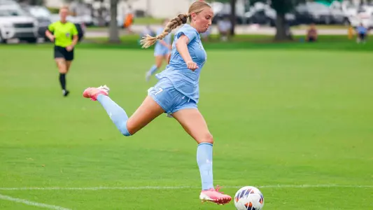 Avery Lang kicking ball