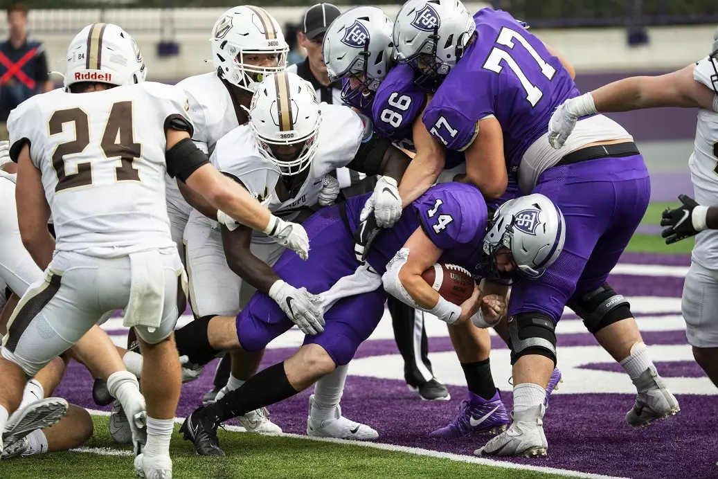 Quaterback Cade Sexauer rushes for a touchdown during the Homecoming Football game against Valparaiso University in St. Paul on October 9, 2021.
