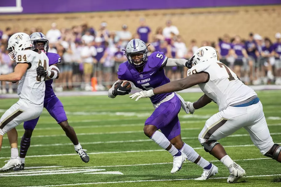 Joshua Slaughter runs after an interception during the Homecoming Football game against Valparaiso University in St. Paul on October 9, 2021.