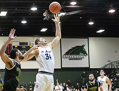 Men's Hoops rolls to 3-0 start with hard-fought win Image