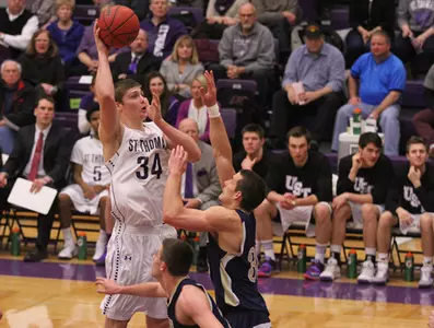 OT loss for Men's Hoops against Bethel Image