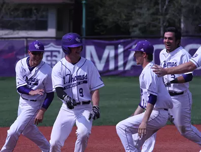 Carpenter's game-winner in 12th lifts Baseball in split Image