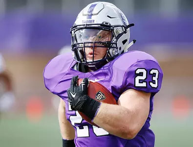 Defense shines, Football cruises past Eagles Image