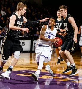 Second-half slump costs Men's Hoops Image