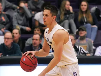 First half run pushes men's basketball to win Image