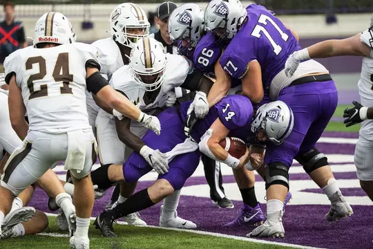 Quaterback Cade Sexauer rushes for a touchdown during the Homecoming Football game against Valparaiso University in St. Paul on October 9, 2021.