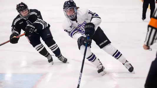 Anna Solheim navigates the puck down the rink on February 17, 2021 at the St. Thomas Ice Arena in Mendota Heights where the University of St. Thomas Womenâ??s Hockey team lost to Hamline University with a final score of 3-4.