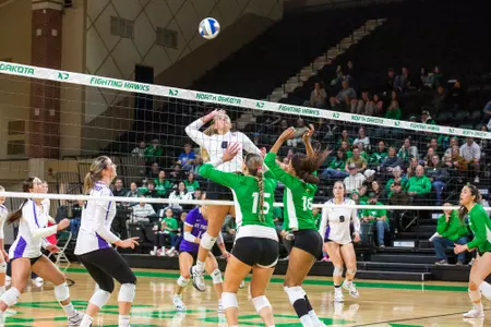 Megan Wetter jumps for an attack at North Dakota