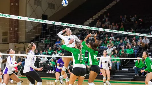 Megan Wetter jumps for an attack at North Dakota