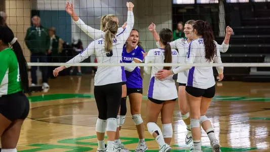 The Tommies celebrate after a point against North Dakota