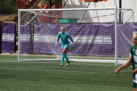 in game photo from exhibition with Green Bay
