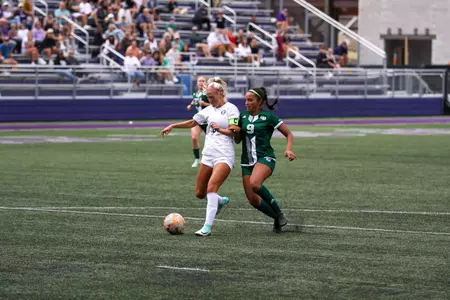 in game photo from exhibition with Green Bay