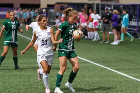 in game photo from exhibition with Green Bay