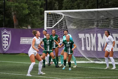 in game photo from exhibition with Green Bay