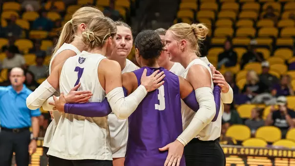 A group of Tommies huddle following a point Sunday, August 30 at Wyoming.