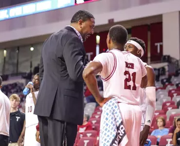 Coach Gilbert coaching his players up