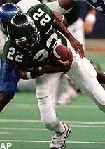 Terrell Harris struggles to<br>break away from the<br>tackle of Memphis' Tony<br>Brown after catching a<br>pass during the first<br>quarter.
