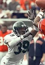 Delando Davis rushes<br>the passer in the first<br>quarter of Saturday's game.