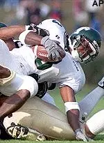 Jeff sanchez is brought<br>down during the second<br>quarter against Navy.