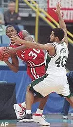 Tulane's Marlo Miles forces N.C. State's Clifford Crawford out of bounds in first-half action Wednesday.
