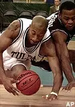 Tulane's Sterling Davis dives for a loose ball in the first half of the Green Wave's 64-60 win over Texas A&M Wednesday.