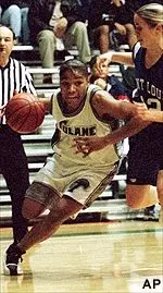 Tulane's Grace Daley drives toward the basket while being closely guarded by Saint Louis' Christan Shelton during first half Friday night.