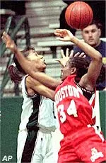 Tulane's Grace Daley and Houston's Shunta Hart battle for a loose ball during the first half Thursday.