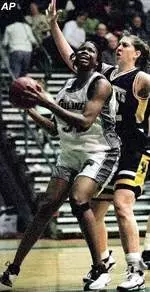 Tualne's Janell Burse prepares to shoot while Marquette's Sarah Zawodny closely defends during the first half Saturday.