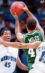 Marlo Miles drives the lane against a host of Memphis defenders during the first half of Wednesday's game.