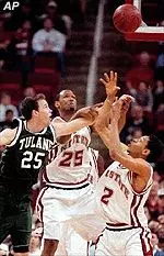 Tulane's Dylan Osean battles North Carolina State's Tim Wells and Anthony Grundy.