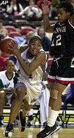 Tulane's Grace Daley drives the baseline past the defense of Cincinnati's Madinah Slaise during action of their Conference USA quarterfinal tournament game Saturday.