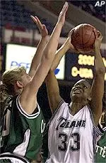 North Carolina-Charlotte's Jennifer Smith attempts to block the shot of Janell Burse during action of their Conference USA semifinal game Sunday.