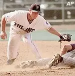 Tulane infielder Andy Cannizaro, left, makes a late tag on Notre Dame's Paul O'Toole as O'Toole slides safely into second base in the top of the eighth inning Friday, May 26, 2000, during the opening game of the NCAA regional tournament in Starkville, Miss.
