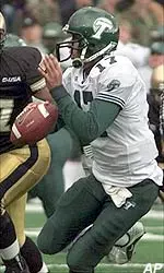 Quarterback J.P. Losman scrambles past an Army defender in the second quarter.